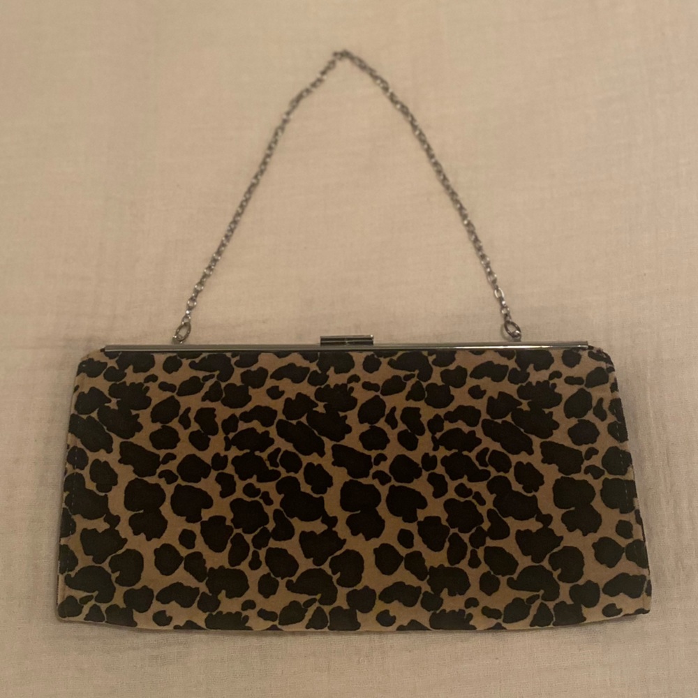 Leopard print clutch purse with silver-colored clasp